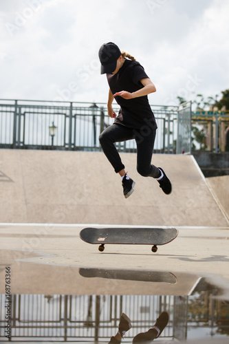 Skater jumping in skate park