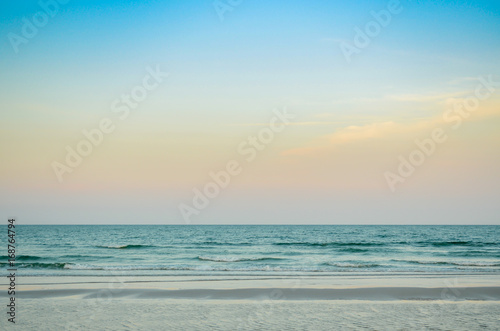 Tropical beach, sand, wave at sunset or sunrise time. Summer holiday concept. © GypsyGraphy