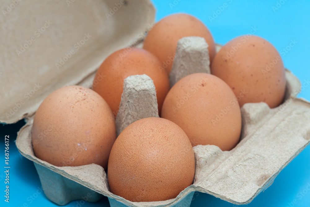 paper egg tray box on blue background paper egg tray box on blue background