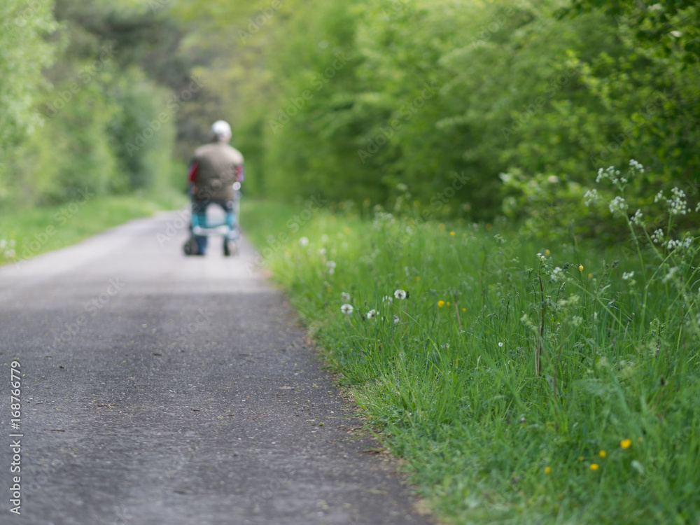 Obraz premium old man walking on road