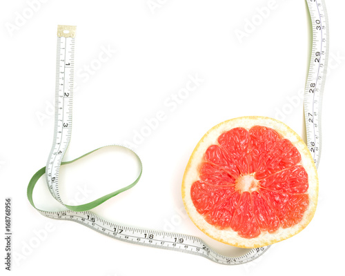 Fresh grapefruit and tape measure and for fitness on white background, concept of slimming, healthy lifestyles and nutrition
