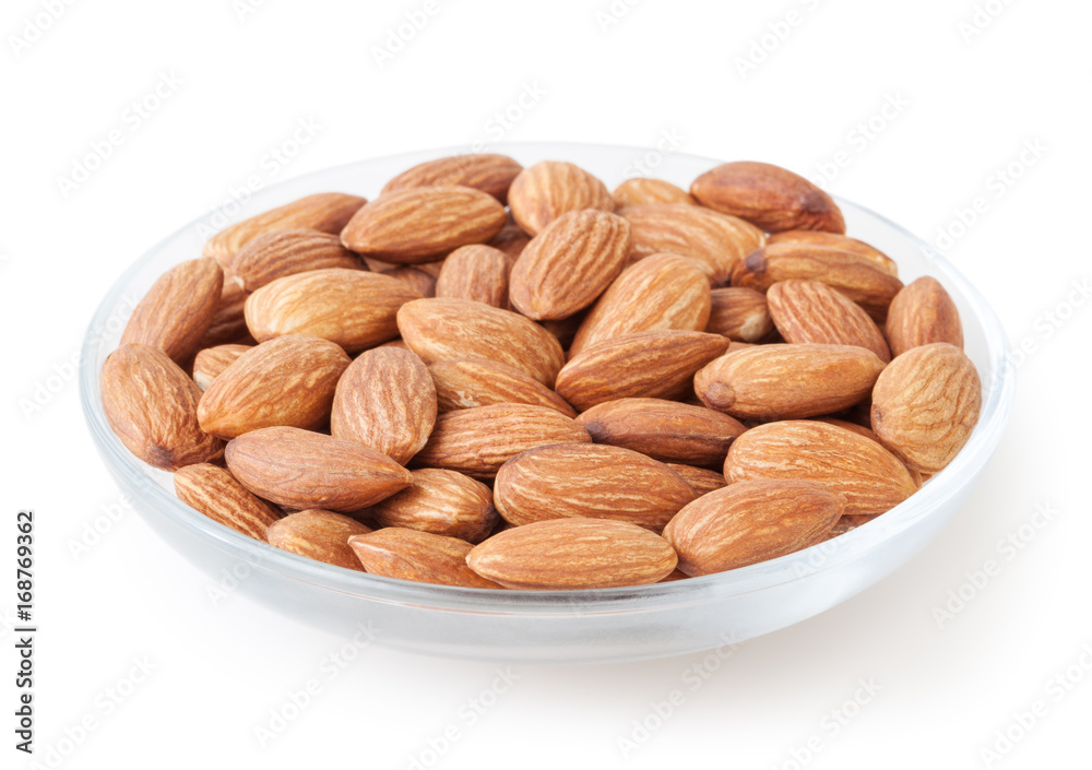 Almonds in glass bowl isolated on white background Almonds in glass bowl isolated on white background