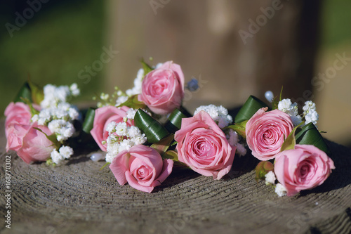 Floral statement for rustic minimalist wedding theme with roses and baby's-breath and shallow depth of field