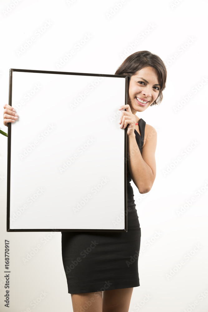 Beautiful young woman holding a blank sheet of paper Beautiful young woman holding a blank sheet of paper