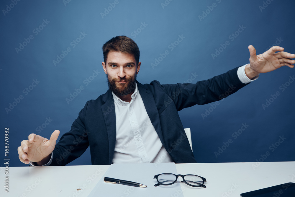 Business man with a beard working at his desk in the office Business man with a beard working at his desk in the office