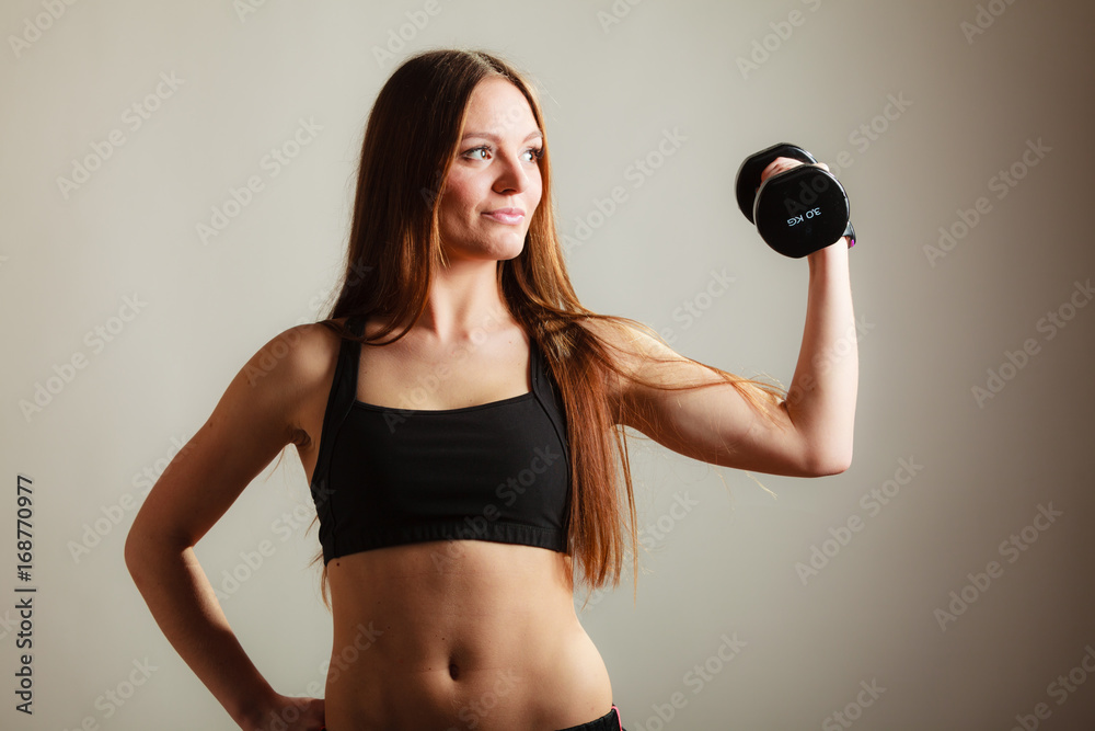 Fit woman exercising with dumbbells. Fit woman exercising with dumbbells.