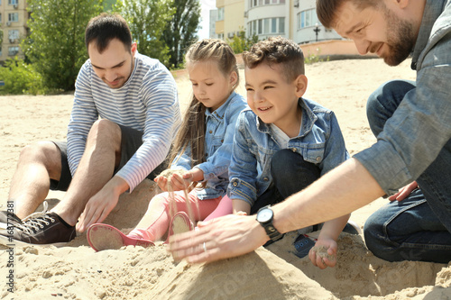Male gay couple with childr...