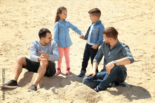 Male gay couple with childr...