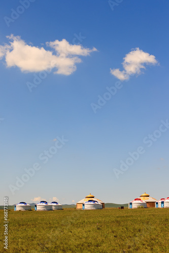 Mongolian traditional houses in immense grassland.They call these tents as ''Yurt''
