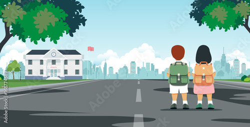 Schoolboy carrying student bag walks to school