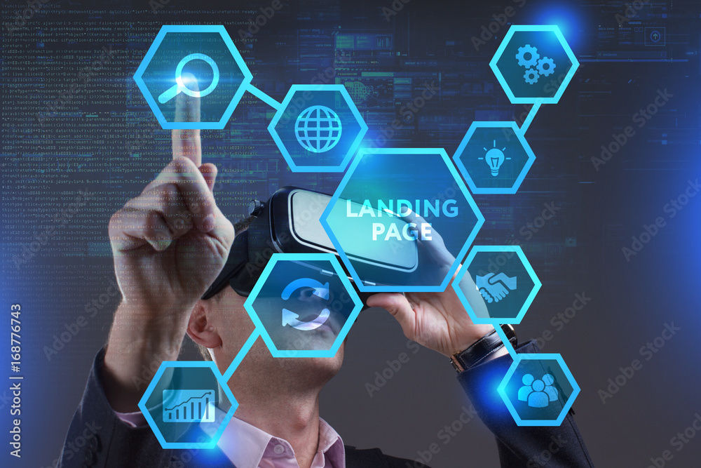 Business, Technology, Internet and network concept. Young businessman working on a virtual screen of the future and sees the inscription: Landing page Business, Technology, Internet and network concept. Young businessman working on a virtual screen of the future and sees the inscription: Landing page