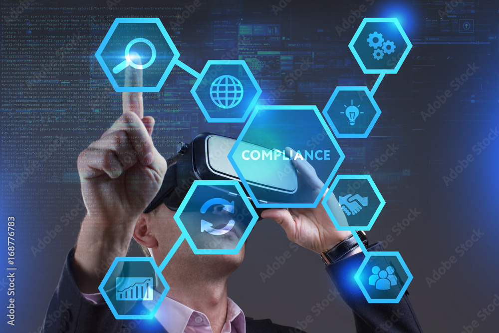 Business, Technology, Internet and network concept. Young businessman working on a virtual screen of the future and sees the inscription: Compliance Business, Technology, Internet and network concept. Young businessman working on a virtual screen of the future and sees the inscription: Compliance