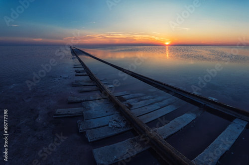 Beauty sunset on salty lake © olinchuk