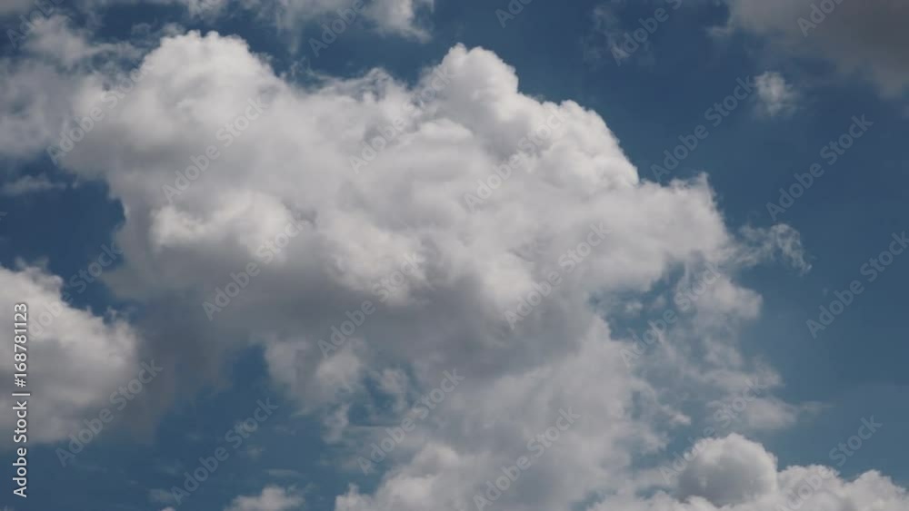 Skyscape or cloudscape. Blue sky with white clouds moving across it. Weather. Time lapse. 4K ProRes HQ codec Skyscape or cloudscape. Blue sky with white clouds moving across it. Weather. Time lapse. 4K ProRes HQ codec