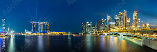 Canvas Print Panoramic view of Singapore business district skyline during laser show in the evening