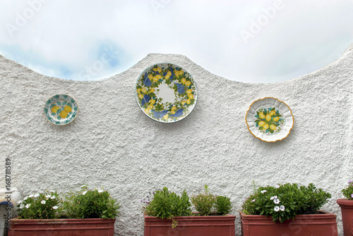 Ischia; S.Angelo, a wall with ceramic plates.