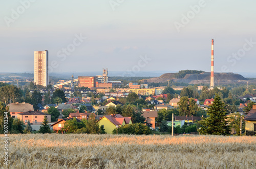 Summer urban landscape. View from the hill to the houses and coalmine. photo