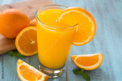 Glass of Fresh Orange Juice With Slice on Side