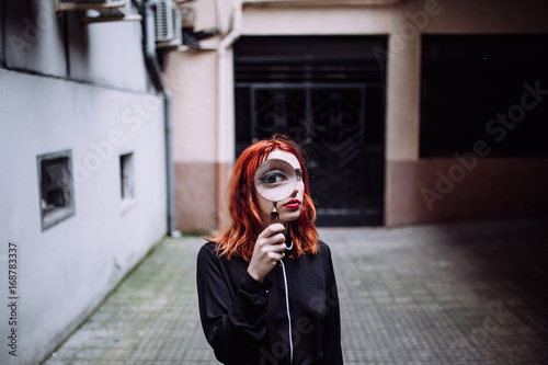 woman looking trough a magnifying glass