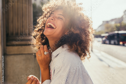 Beautiful mixed race woman laughing photo