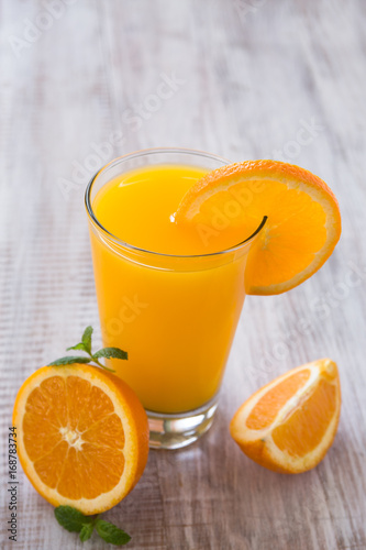 Glass of Fresh Orange Juice with Slice of Orange