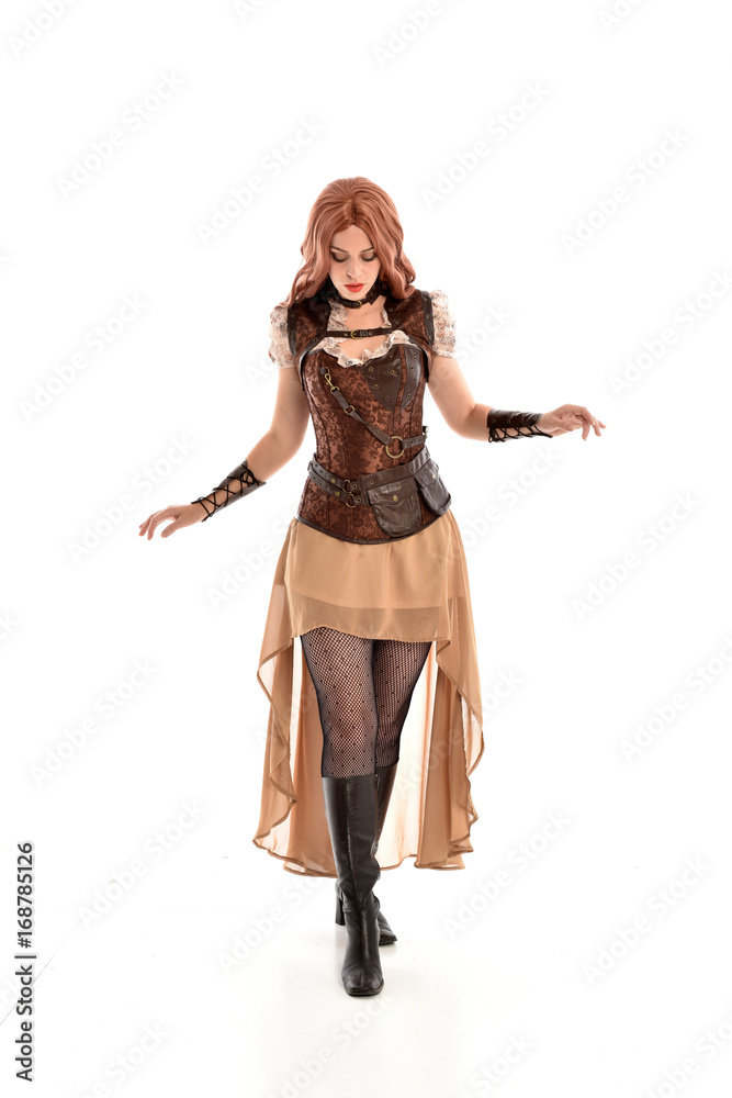 full length portrait of a red haired lady wearing steampunk inspired outfit, standing pose against a white background. full length portrait of a red haired lady wearing steampunk inspired outfit, standing pose against a white background.