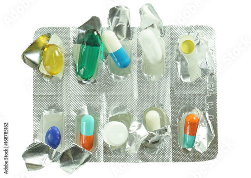 Set of pills and capsules. Tablets in blisters vitamins and aspirin on white background.
