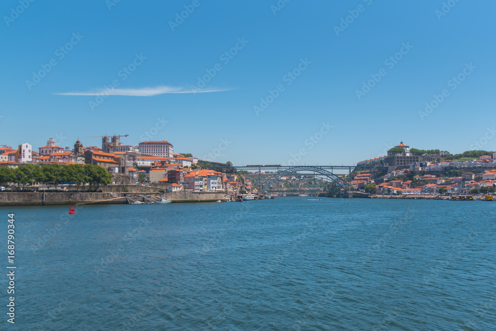 Porto, Portugal, panorama of Dom Luis bridge, the river Douro and tiles roofs
