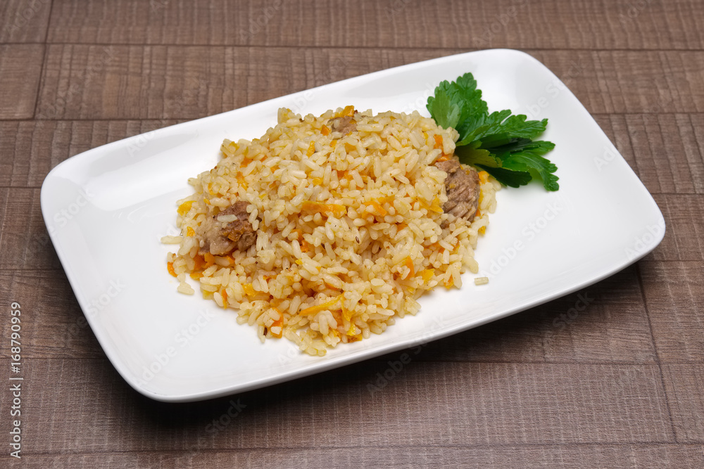 Portion of pilaf on square plate Portion of pilaf on square plate