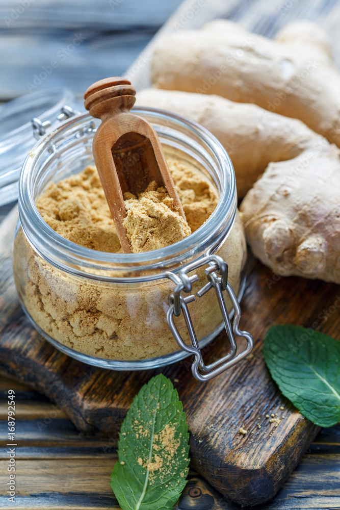 Fototapeta premium Ground ginger in a glass jar.