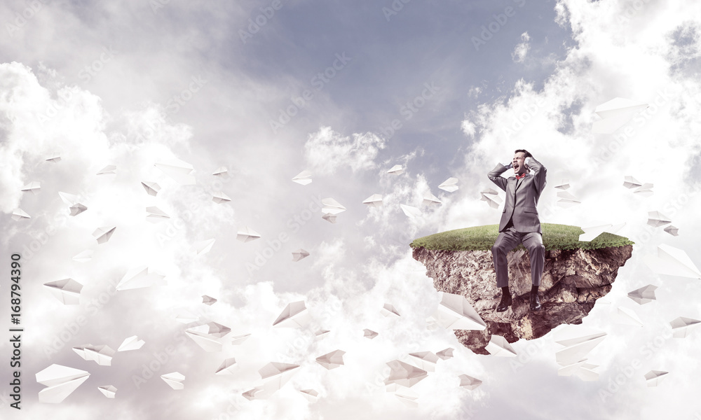 Obraz premium Young man in sky dont want to hear anything and paper planes fly