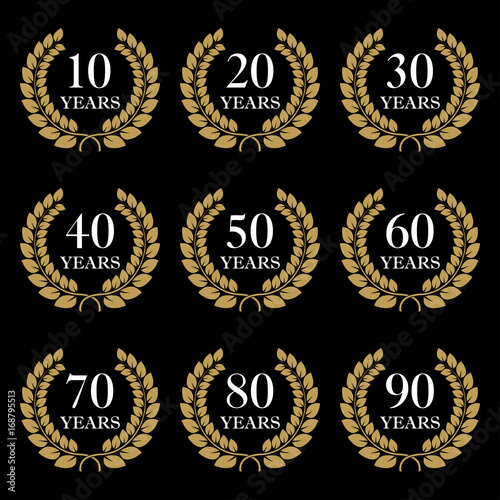 Anniversary icon set. 10,20,30,40,50,60,70,80,90 years design elements with laurel wreath symbol. Vector illustration.