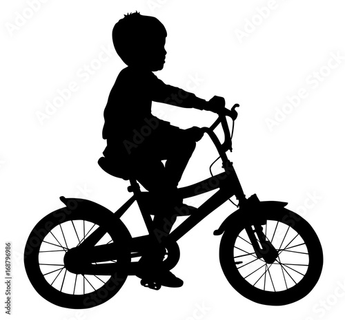 Little boy riding bicycle vector silhouette illustration isolated on white background.
