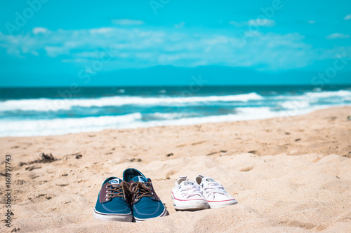 Two shoes on the beach