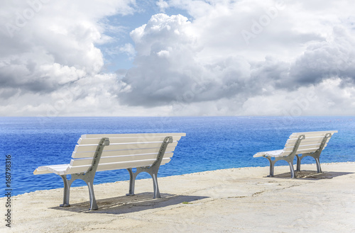 White bench on the waterfront.