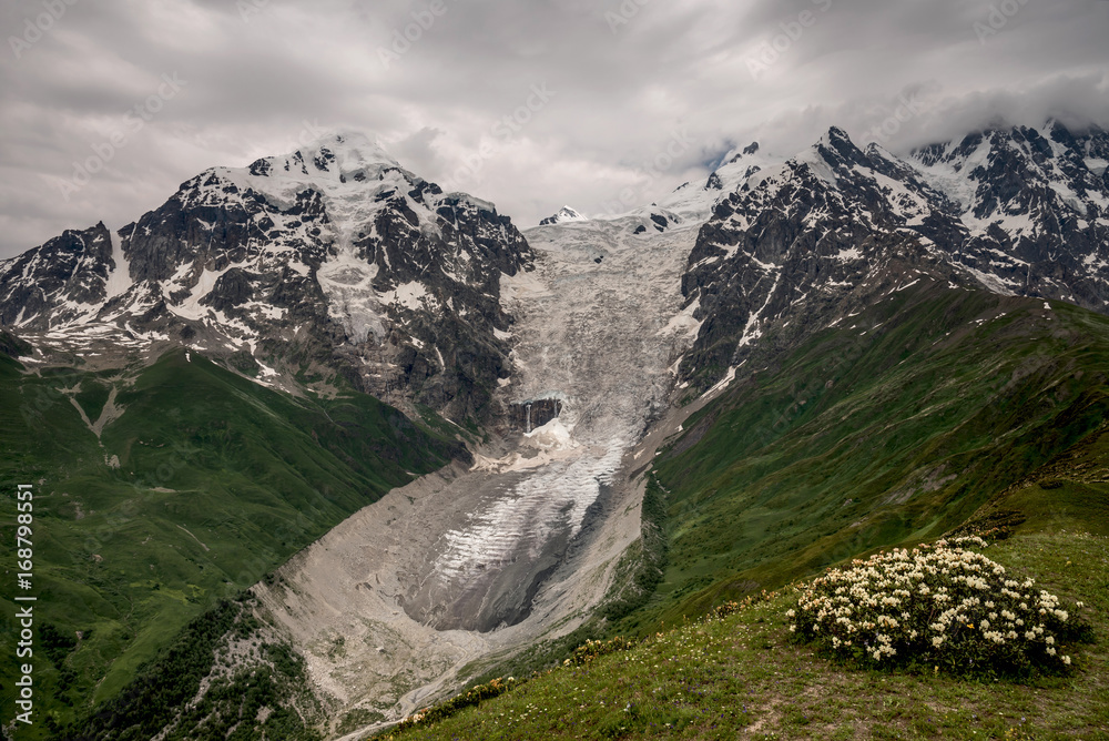 Scenic view of Tetnuldi mountain and glacier with ice tongue in Caucasus mountains, Svaneti, Georgia