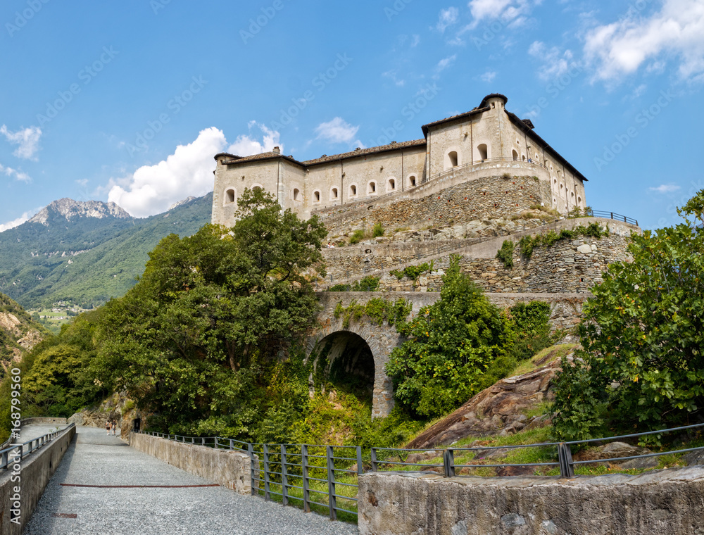 Fort Bard, Valle d'Aosta, Italy - August 18, 2017: Historic military construction defence Fort Bard. Touristic medieval fortress in Italian Alps. Location of the Avengers: Age of Ultron film.