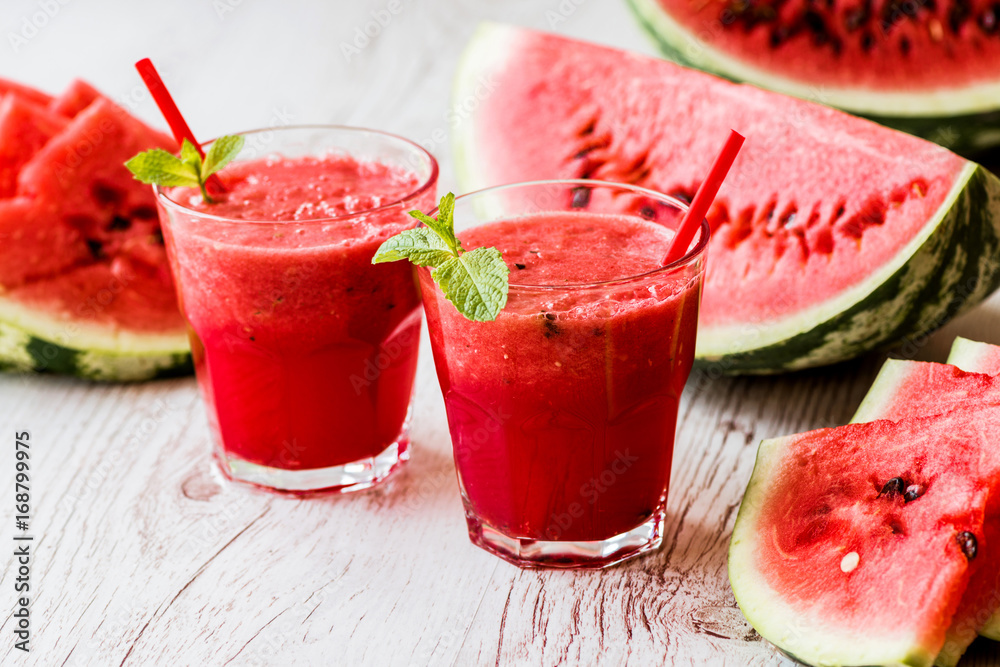 healthy drinks. watermelon smoothie on white wooden background healthy drinks. watermelon smoothie on white wooden background