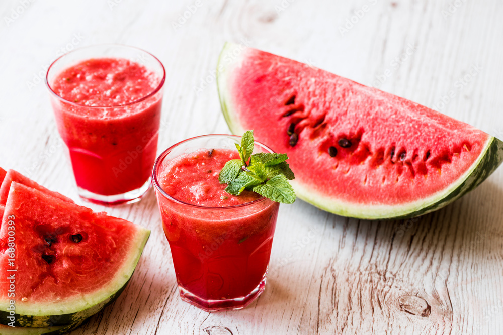 healthy drinks. watermelon smoothie on white wooden background healthy drinks. watermelon smoothie on white wooden background