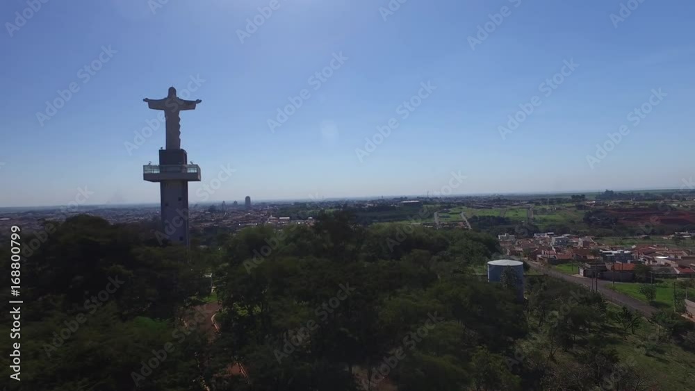 Aerial view of Christ the Redeemer in the city of Sertozinho, May, 2017 - Sao Paulo, Brazil. Aerial view of Christ the Redeemer in the city of Sertozinho, May, 2017 - Sao Paulo, Brazil.