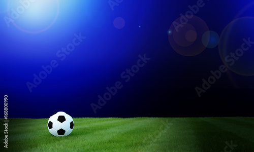 Football black and white color on grass soccer field with blurred blue gradient background.3D Rendering © imartorn