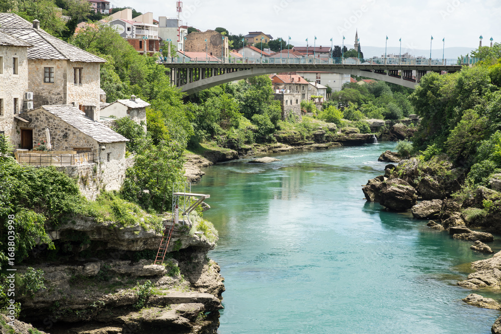 Looking south from the reconstructed Old Bridge (Stari Most) over the River Neretva, Mostar, Bosnia and Herzegovina.