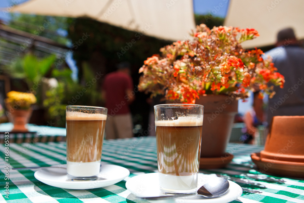 coffe on street cafe table Checkered tablecloth