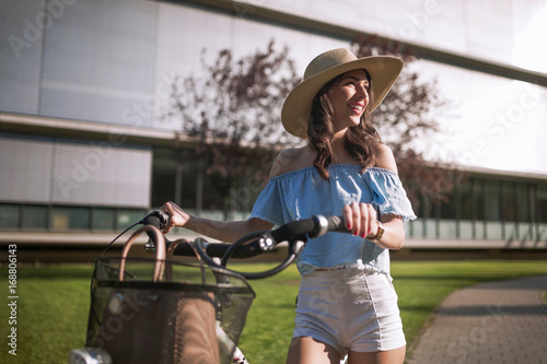 Portrait of beautiful woman enjoying time on bicycle