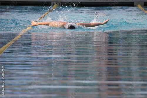 a female swimmer performing butterfly stroke