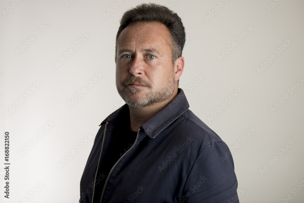 Man in Navy Blue Jacket Over Gray Background