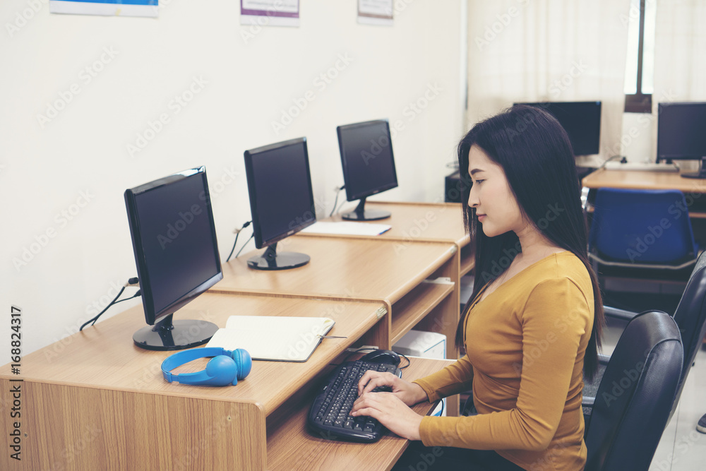 Young woman using computer at office.