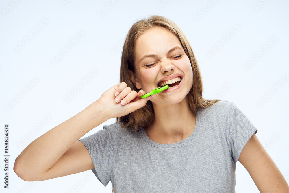 Young woman on white isolated background holds a spinner Young woman on white isolated background holds a spinner