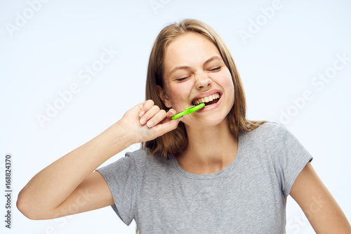 Young woman on white isolated background holds a spinner