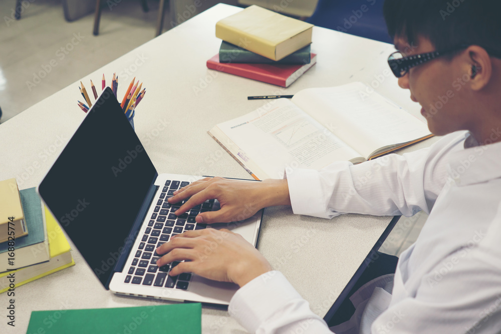 Student making research on laptop and browse internet. Education concept. Student making research on laptop and browse internet. Education concept.